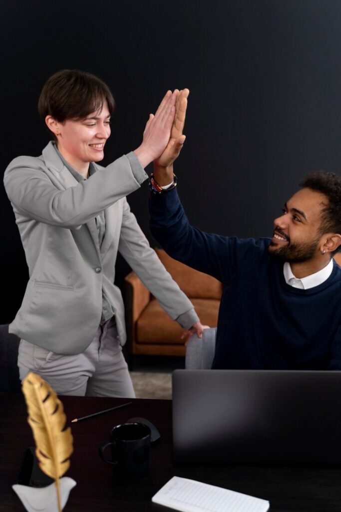 trans person working office with colleagues 23 2149286982